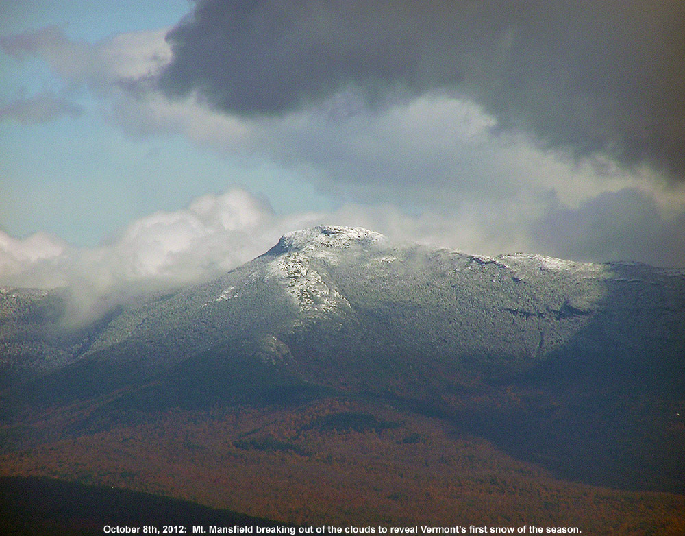 An image of Mt. Mansfield in Vermont taken from the Burlington area on October 8th, 2012 showing the first snowfall of the season on the peak with some of the fall foliage below 