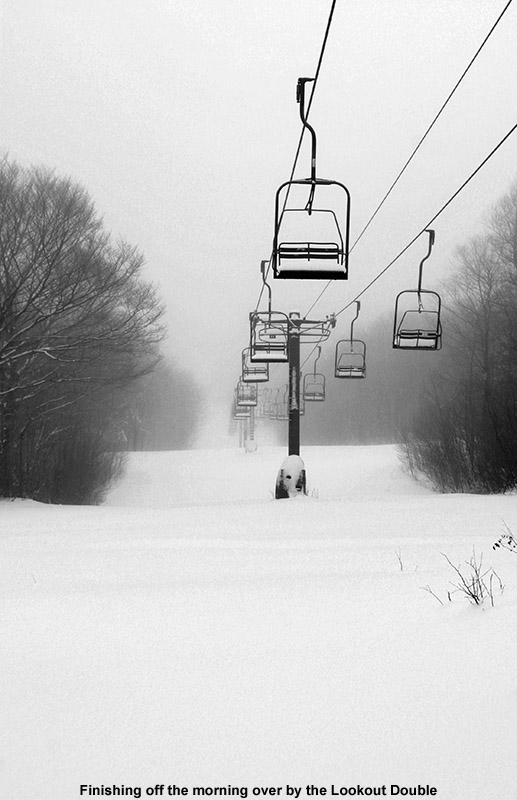 An image of the Lookout Double Chairlift with fresh powder below it at Stowe Mountain Resort in Vermont