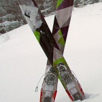 An image of my Black Diamond AMPerage powder skis sitting in snow while I get ready for a descent at Stowe Mountain Resort in Vermont