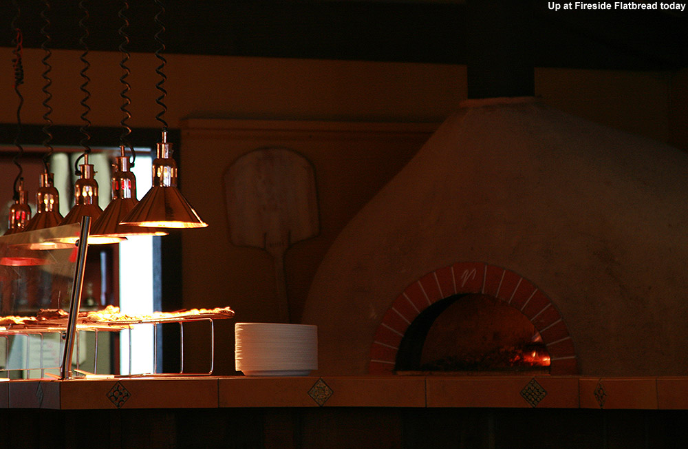 An image of the wood-fired pizza oven at Fireside Flatbread restaurant in the base lodge of Bolton Valley Ski Resort in Vermont