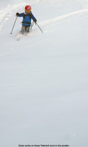 An image of Dylan Telemark skiing in powder on the Showtime trail at Bolton Valley Ski Resort in Vermont