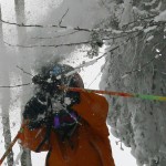 An image of Ty with his hands up as he blasts through some trees at Bolton Valley Ski Resort in Vermont
