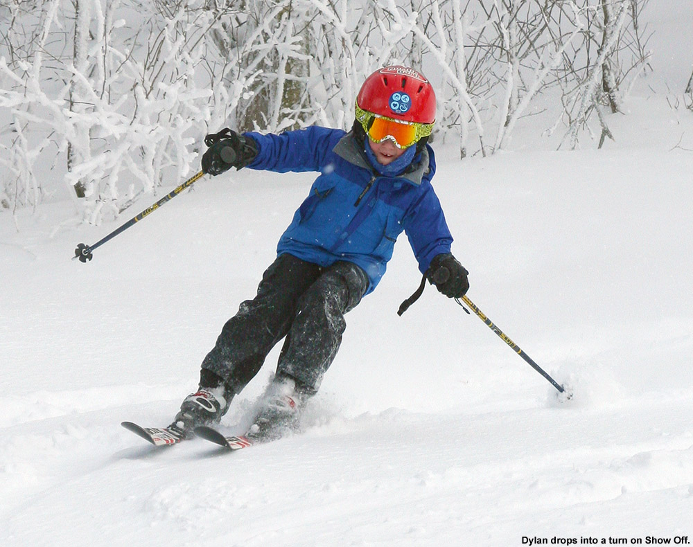 An image of Dylan leaning into a turn in soft snow on the Show Off trail at Bolton Valley Ski Resort in Vermont