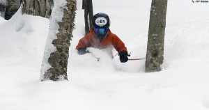 An image of Ty skiing waist deeppowder in the KP Glades at Bolton Valley Resort in Vermont thanks to winter storm Nemo