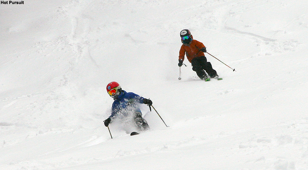 An image of Dylan and Ty skiing powder on the Spell Binder trail at Bolton Valley Resort in Vermont