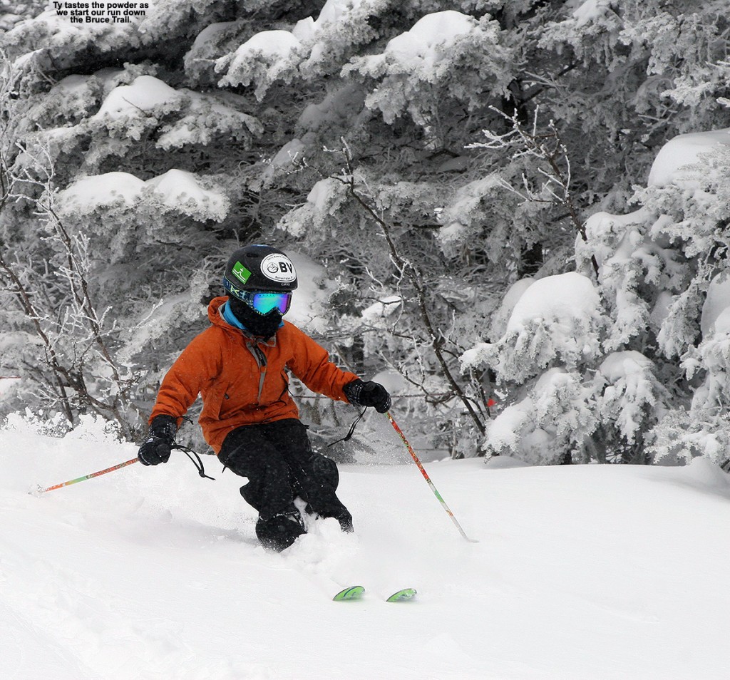An image of Ty skiing powder at the top of the Bruce Trail at Stowe Mountain Resort in Vermont