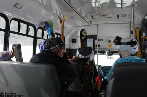 An image of skiers riding the Mountain Road Shuttle Bus in Stowe