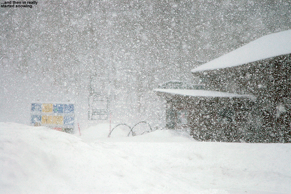 An image of heavy snowfall at the base of Bolton Valley Ski Resort in Vermont during an early April snowstorm