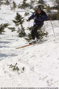 An iamge of Jay skiing in one of the alpine gullys up above Stowe Mountain Ski Resort in Vermont
