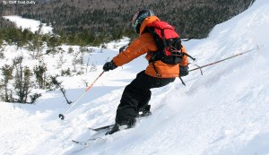 An image of Ty skiing in the Cliff Trail Gully in the alpine terrain above Stowe Mountain Resort in Vermont