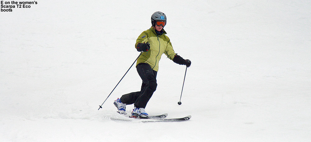 An image of Erica skiing in spring snow at Stowe Mountain Resort in Vermont as she tries out the Scarpa Women's T2 Eco Telemark ski boots