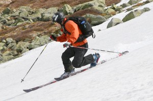 An image of Jay Telemark skiing on the East Snowfields of Mt. Washington in New Hampshire in May