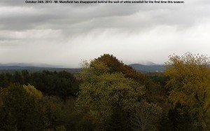 An image of Mt. Mansfield in Vermont hidden behind the first snowfall of the season in October