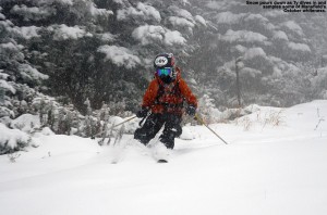 An image of Ty skiing early October powder on the Perry Merrill trail at Stowe Mountain Resort in Vermont