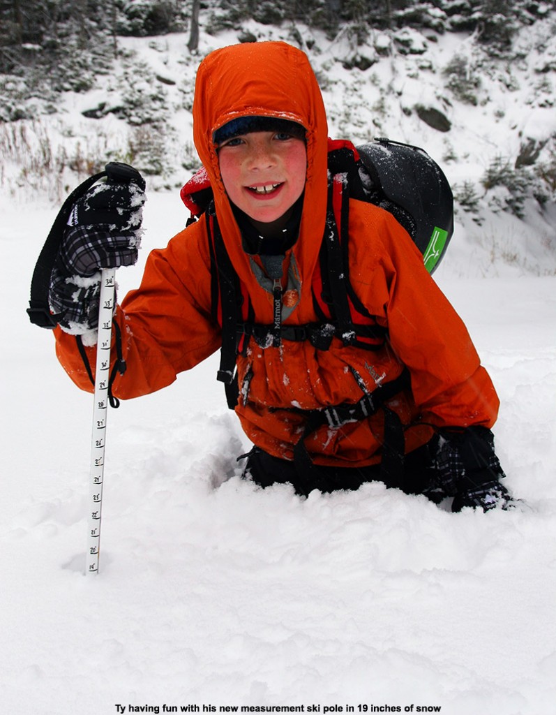 An image of Ty in 19 inches of October snow up near the Cliff House at Stowe Mountain Resort in Vermont