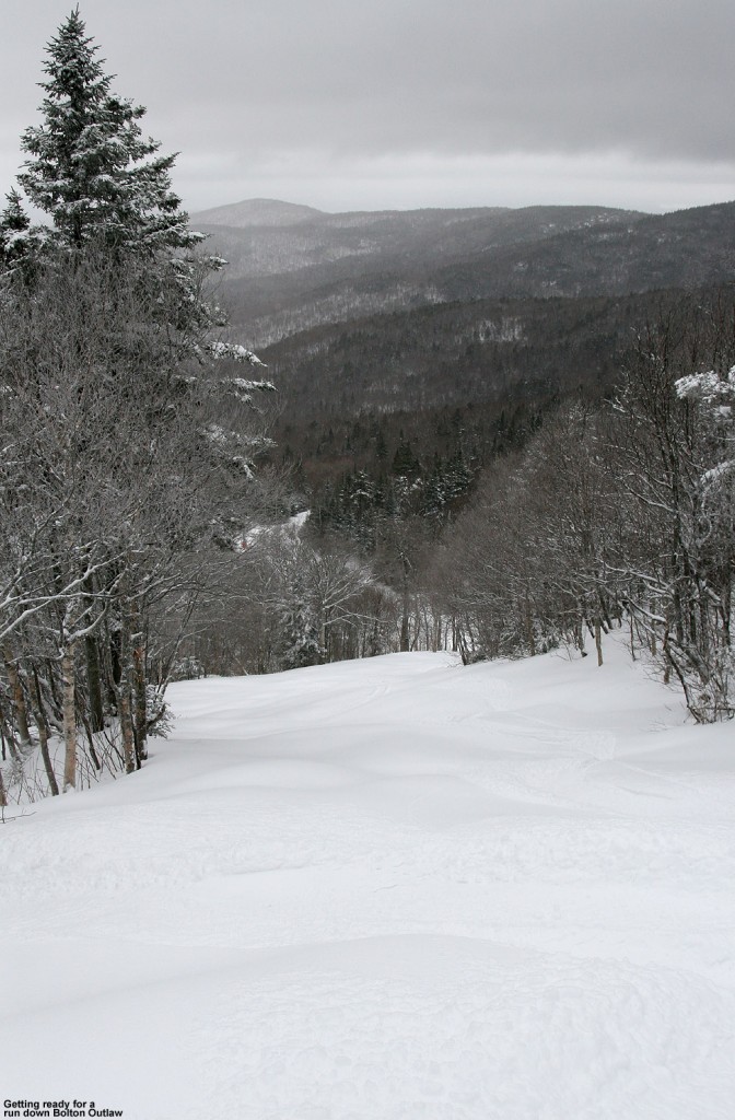 An image looking down the Bolton Outlaw trail with fresh snow at Bolton Valley Ski Resort in Vermont 
