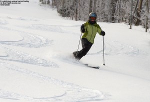 An image of Erica skiing a bit of powder on the Interstate trail at Jay Peak Resort in Vermont