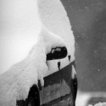 An image of a car covered in snow in the village at Bolton Valley Ski Resort in Vermont