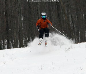 An image of Ty jumping in some powder snow on the Spell Binder trail at Bolton Valley Ski Resort in Vermont