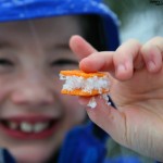 An image of Dylan holding up one of the Cheeze-It and snow sandwiches he made on our backcountry ski outing at Bolton Valley Ski Resort in Vermont