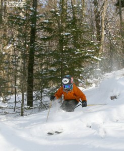 An image of Ty skiing powder in Maria's Woods at Bolton Valley Resort in Vermont