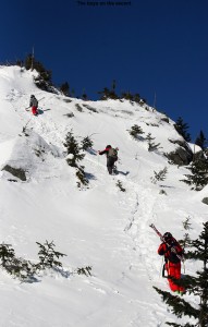 An image of Luc, Jack, and Kenny heading up the boot ladder in the Cliff Trail Gully on Mt. Mansfield above Stowe Mountain Ski Resort in Vermont 