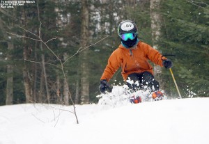 An image of Ty skiing some dense spring powder in the Deer Run area of Bolton Valley Ski Resort in Vermont