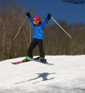 An image of Dylan jumping in the air on skis at Bolton Valley Ski Resort in Vermont
