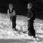 An image of Ty and Dylan on their skis during a descent of the North Slope trail at Stowe Mountain Resort in Vermont in mid May 