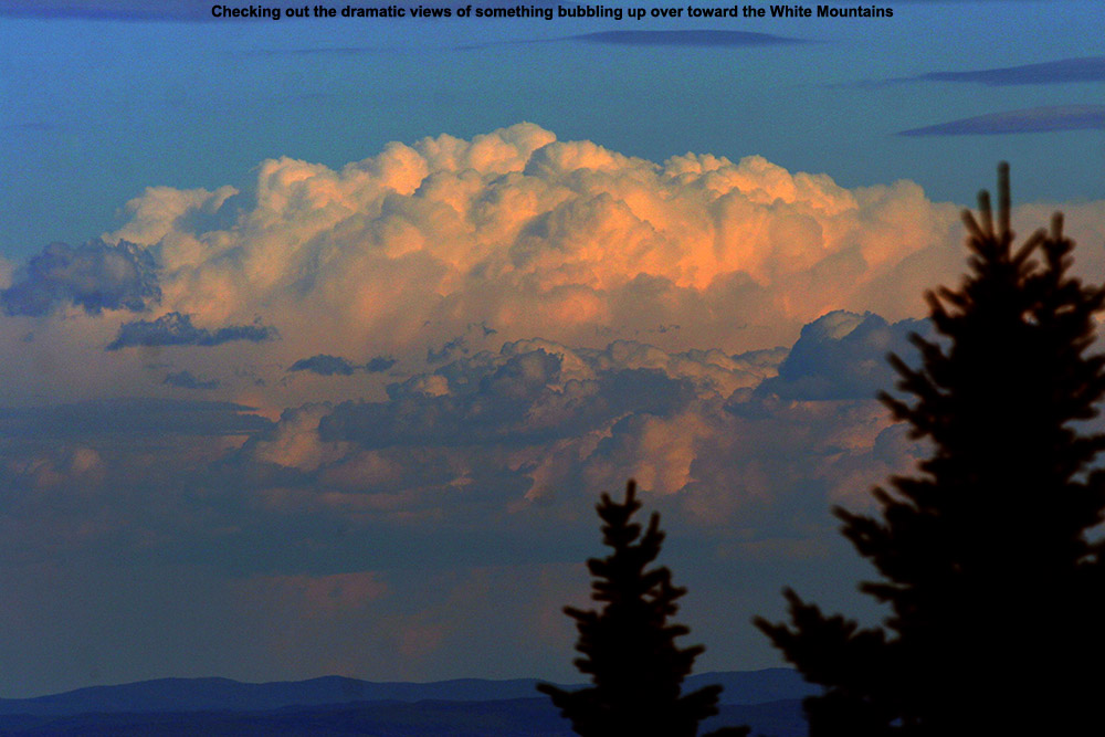 An image of thunderclouds off to the east in New Hampshire as viewed from near the Octagon summit building at Stowe Mountain Ski Resort in Vermont