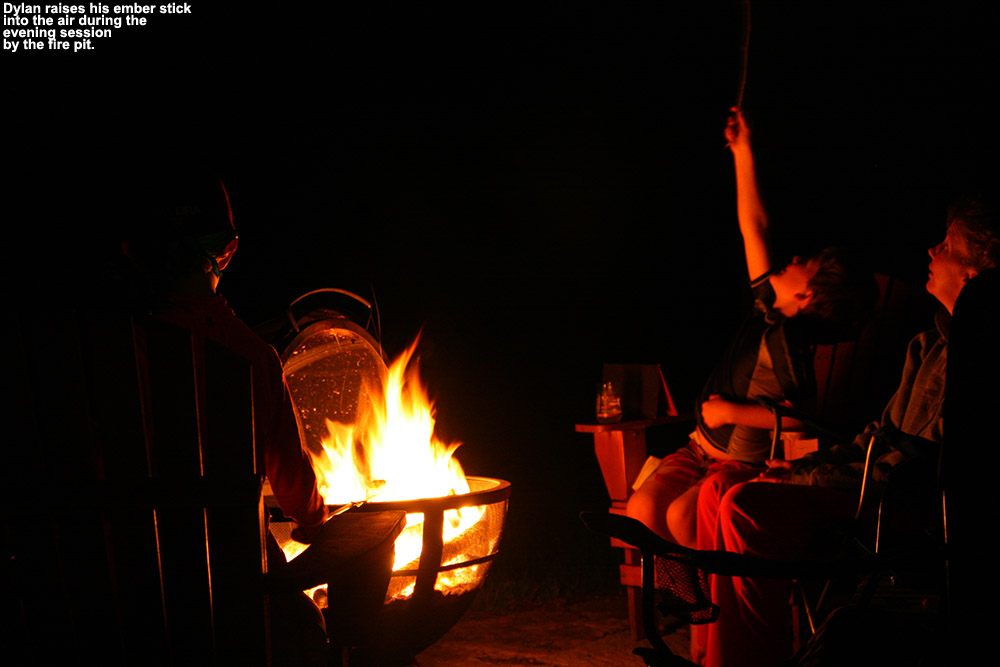 An image of Erica, Dylan, and Ty by the fire pit in Waterbury Vermont