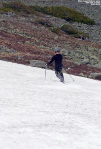 An image of Erica skiing the snowfields on Mt Washington in New Hampshire in June