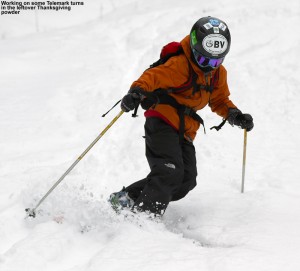 An image of Ty Telemark skiing in powder on the Old Turnpike trail at Bolton Valley 
