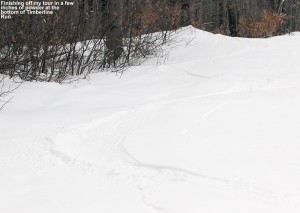 An image of ski tracks in powder on the Timberline Run trail at Bolton Valley Ski Resort in Vermont