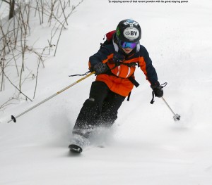 An image of Ty skiing powder on the Timberline Run trail at Bolton Valley Ski Resort in Vermont