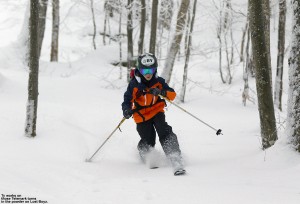 An image of Ty Telemark skiing in the Lost Boyz glade at Bolton Valley Ski Resort in Vermont