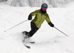 A picture of Erica skiing in fresh snow on the Show Off trail at Bolton Valley Ski Resort in Vermont