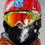 An image of Dylan with powder snow on his face and helmet at Bolton Valley Resort in Vermont