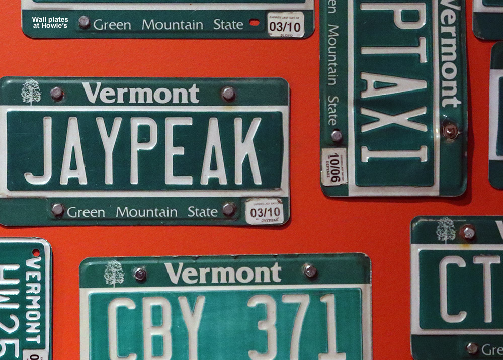 An image of Vermont license plates on the wall at Howie's restaurant at Jay Peak Resort