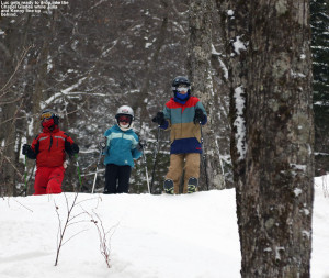 An image of Luc, Julia, and Kenny lining up to drop into the Chapel Glades area at Stowe Mountain Ski Resort in Vermont