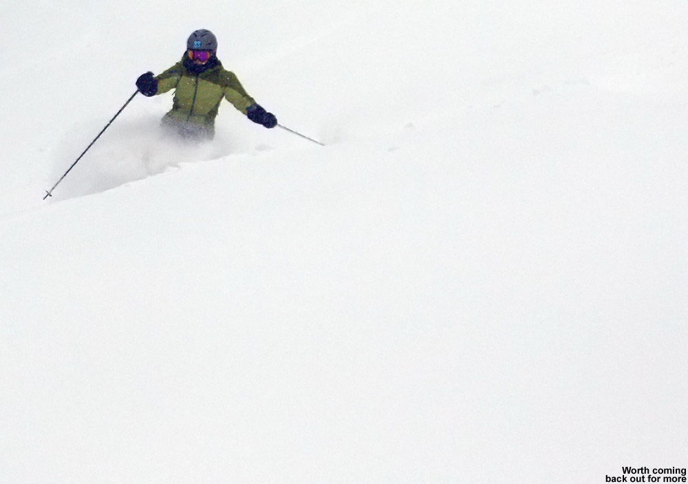 An image of Erica skiing some deep powder on the Tattle Tale Trail at Bolton Valley Ski Resort in Vermont