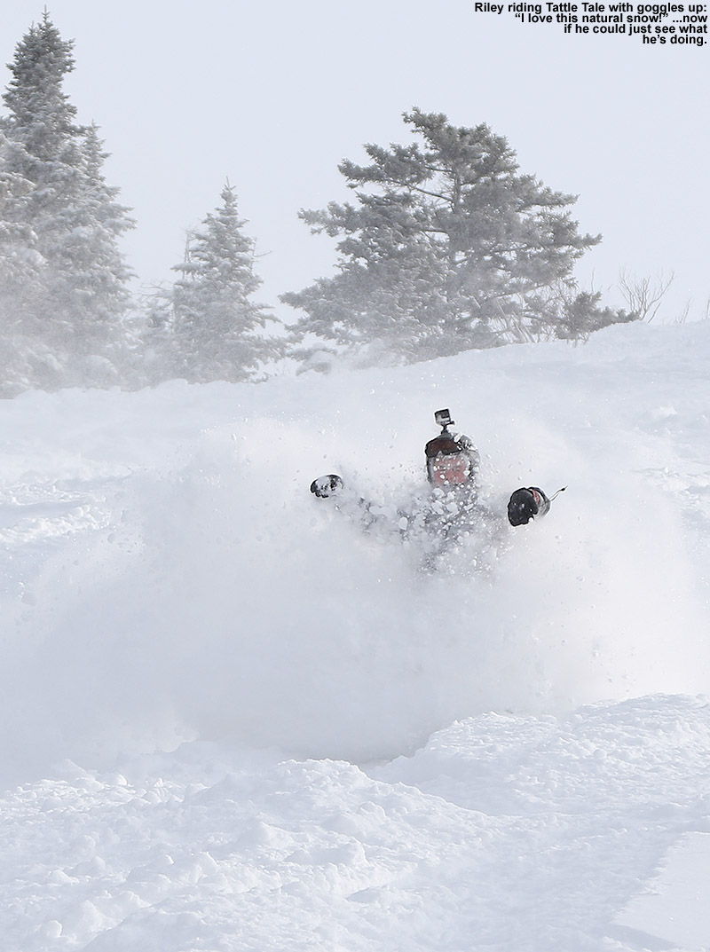 An image of Riley riding his snowboard in deep powder snow on the Tattle Tale trail at Bolton Valley Ski Resort in Vermont