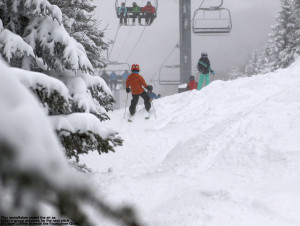 An image of some kids skiing on the Upper National trail at Stowe Mountain Resort in Vermont