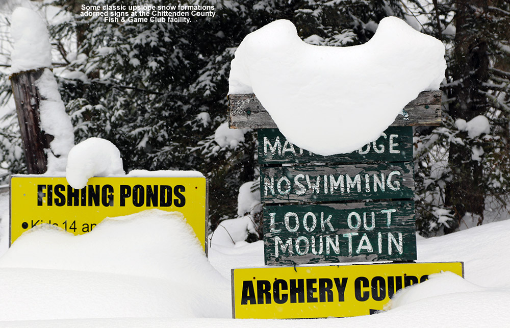 An image showing signs on the grounds of the Chittenden County Fish & Game Club in Richmond, Vermont buried in and covered with snow