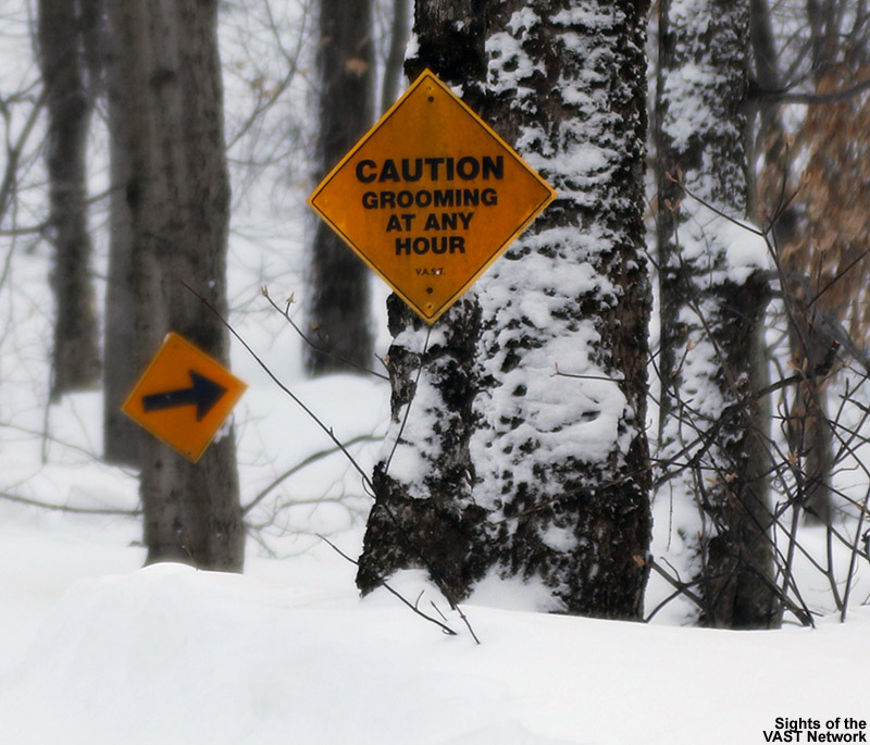 An image showing some trail signs on the VAST snowmobile trail heading from Bolton Valley to Bolton Notch in Vermont
