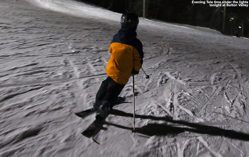An image of Ty Telemark skiing at night at Bolton Valley Resort in Vermont