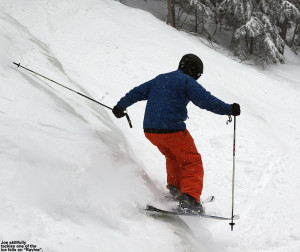 An image of Joe skiing one of the ice falls on the Ravine trail at Stowe Mountain Resort in Vermont