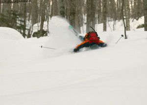 An image of Ty crashing in the powder on a backcountry ski tour in the Lincoln Gap area of Vermont