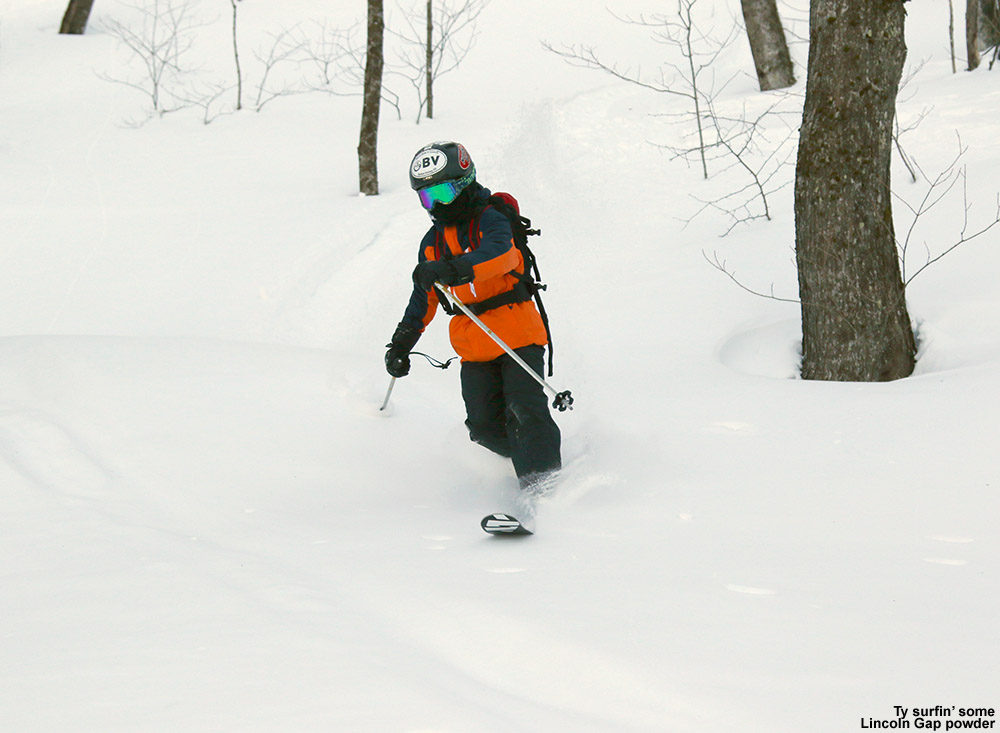 An image of Ty Telemark skiing in powder in the Lincoln Gap backcountry in Vermont