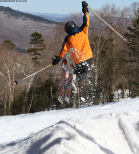 An image of Ty doing a jump on skis at Stowe Mountain Resort in Vermont